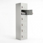 A six-tier light grey steel locker with one door open, showcasing the compact internal storage slots for small personal items.