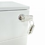 Close-up of a foldable security key inserted into the central lock of an iSimply white steel pedestal, demonstrating the anti-snap, space-saving design.