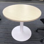 Installation of round discussion table at a Singapore office breakout area.