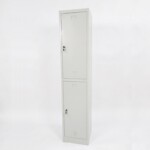 A tall, light grey two-door steel locker featuring two large vertical compartments, each with secure key locks and louvered air vents.