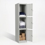 Three compartment light grey steel locker with three vertical doors, with open doors and some item in it to show how spacious the space is.