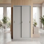 A tall, light grey steel office cupboard with sliding doors and a secure lock set against a modern, bright office background.