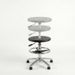 A studio shot of a modern, adjustable PU seat stool on a plain white background, featuring a polished chrome base with wheels and a foot ring.