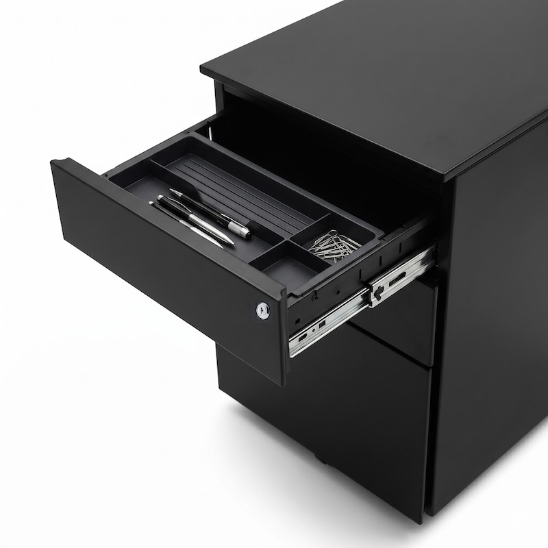 Close-up of an iSimply executive black steel mobile pedestal with the top drawer open, revealing a removable black stationery tray with compartments for office supplies.